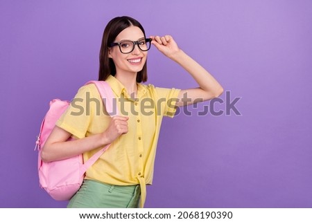 Profile side photo of young school girl eyewear smart rucksack courses isolated over violet color background