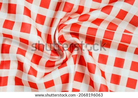 fabric with cherry color gingham pattern.