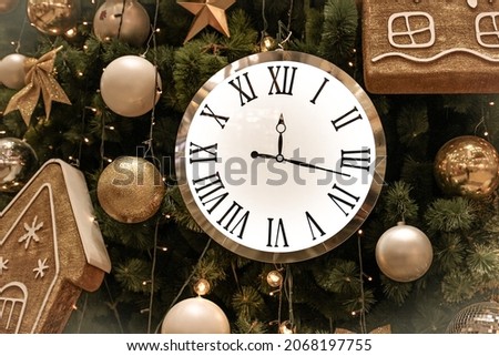 Beautiful golden decorations. toys hanging on a traditional Christmas tree. New year, Christmas, winter holidays background. 