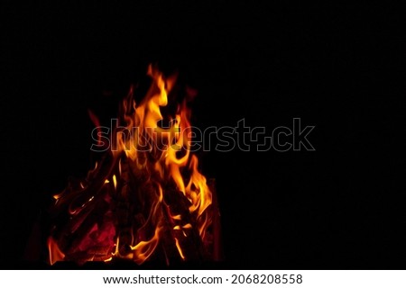 bright flame on a black background, beautiful natural background