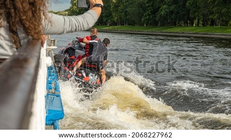 two people on a jet ski are traveling at high speed. advertising picture. outdoor recreation. 
an extreme journey on the water.