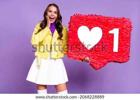 Photo of young excited lady shock hand touch cheek like heart icon pinata advert share repost isolated over purple color background