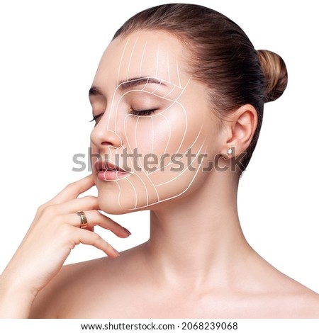 Graphic lines shows face lifting effect on young female face. Royalty-Free Stock Photo #2068239068
