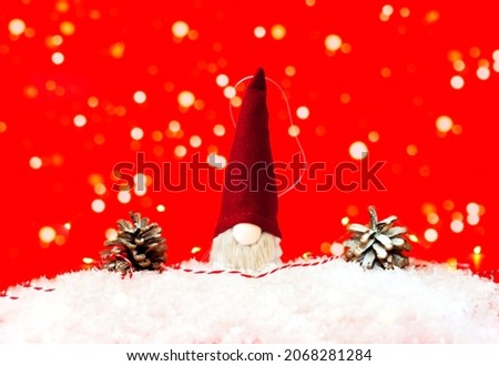 Christmas toy Santa Claus on a red background.Christmas greeting card. Creative copy space. Close-up