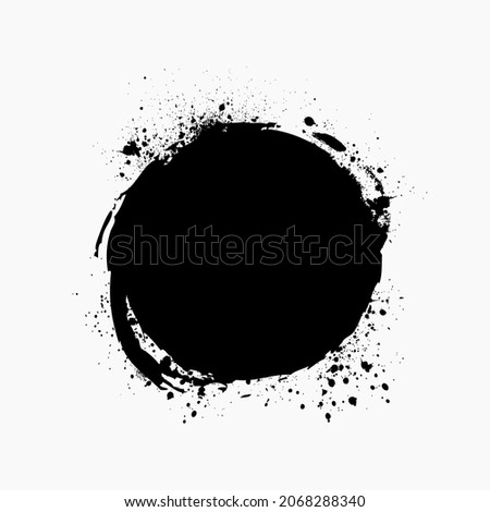 Paint brush stain with ink splashes. Grunge circle shape for frame, banner, text box, clipping masks or other art projects. Vector design element isolated on white background. Royalty-Free Stock Photo #2068288340