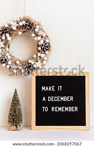 Felt letter board with text make it a december to remember and christmas decoration. Winter holidays celebration concept