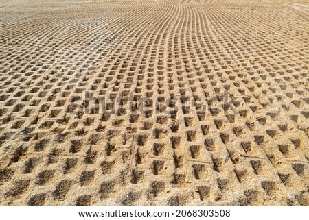 Compaction of soil at the construction site, compaction of soil before construction Royalty-Free Stock Photo #2068303508