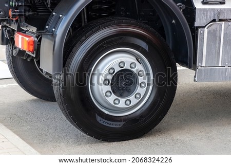 Rear wheels of a truck with new tires, close-up. New tubeless tires on a truck