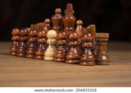 Chess figures on wooden board