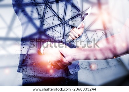 Double exposure picture. Picture mix  building city and businessman is Shake hands show Confident.Picture concept action man and business.