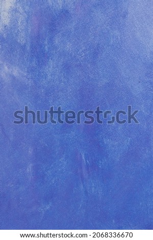 creative background, a spot of heavenly colored primer rubbed on the surface of a linen canvas, temporary object, close, toning 