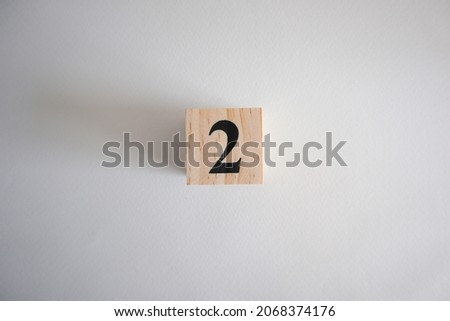 dice made from wooden blocks with number 2