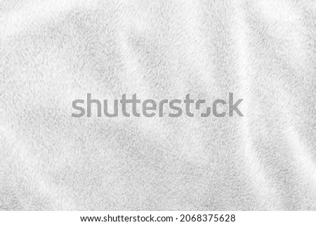 White clean wool texture background. light natural sheep wool. white seamless cotton. texture of fluffy fur for designers. close-up fragment white wool carpet.	