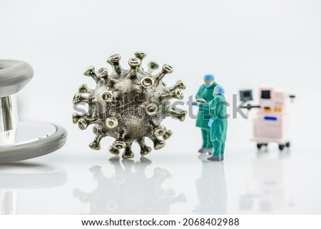 Coronavirus pandemic, medical research concept : Physician or a doctor inspects or investigates a virus model in a laboratory. Coronaviruses are a group of RNA viruses that cause disease in mammals.