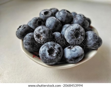 Blueberries in small bowl on gray background.
Blueberry is a flowering plant in the genus Vaccinium, part Cyanococcus