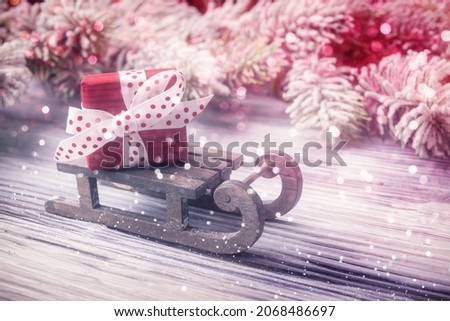 Santa’s sleigh with red box over holiday Christmas background