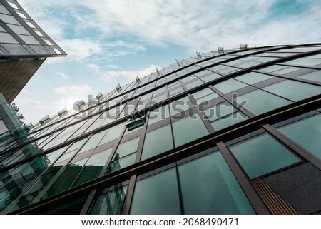 Looking Up Blue Modern Office Building. Background of Modern Glass Building Skyscrapers