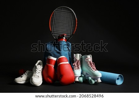 Set of sports equipment on dark background