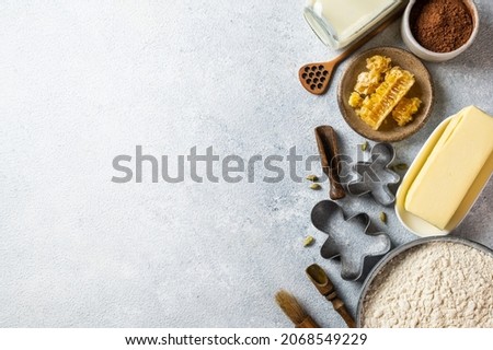 Christmas Baking background. Ingredients for cooking christmas baking on light background. Top view with copy space. Gingerbread cookies. Baking Ginger cookies. Raw dought for cookies.