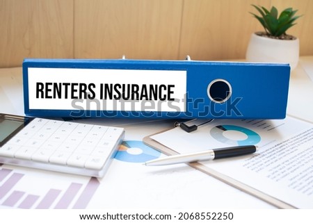Renters insurance words on labels with document binders