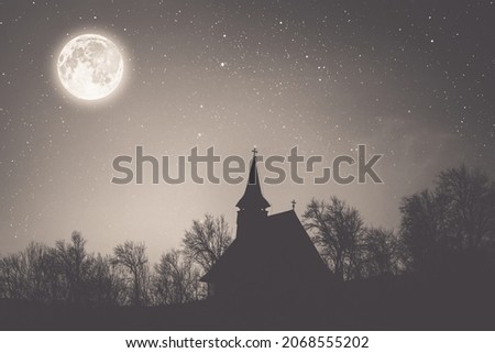 Church and spooky cloudy sky with fog and full moon. Horror Halloween concept.