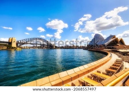 Sydney harbour at Circular quay in City of Sydney with major architecture landmarks and local cafe on a sunny summer day. Royalty-Free Stock Photo #2068557497