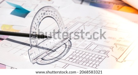 A pencil with a protractor. Architectural Project drawings with tools. Architects workplace. Engineering Interior designer's working table