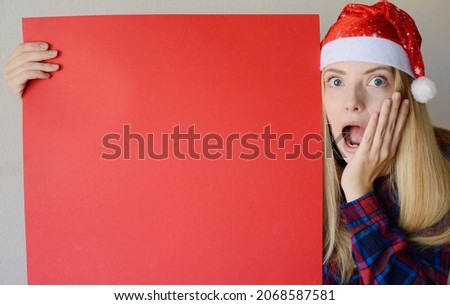 girl in a hat of Santa Claus, a red banner