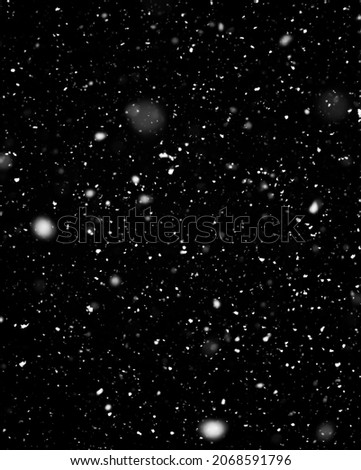 Snow falling on black background. Beautiful Nature Winter texture with snowfall. Natural pattern of snow. Template for Design