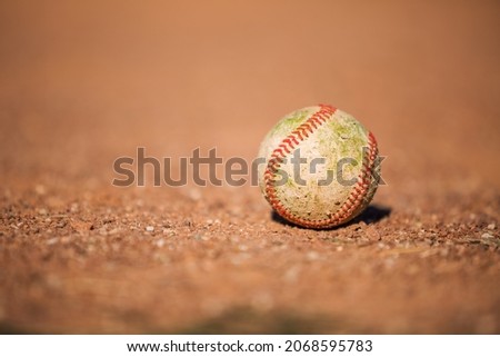 baseball ball on the dirty ground background Royalty-Free Stock Photo #2068595783