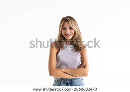 Young woman posing and smiling over white background