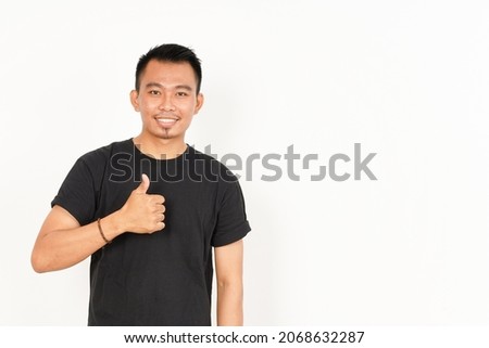 Showing Thumbs Up of Asian Man Wearing Black T-Shirt Isolated On White Background