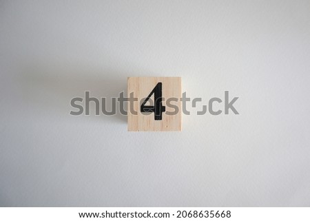 dice made from wooden blocks with  number4
