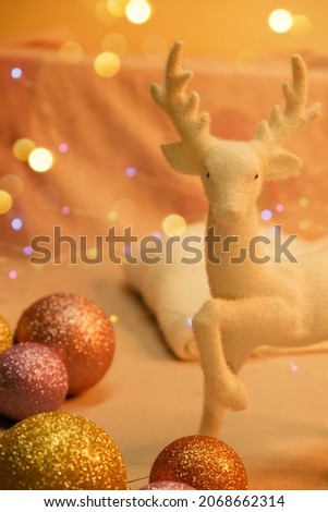 New Year's picture of a white deer on a background of lanterns