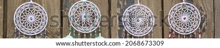 banner of Many Dream catcher with feathers threads and beads rope hanging. Dreamcatcher handmade