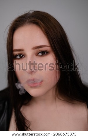 Smoking dark haired beauty