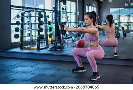 Sport fitness athlete woman with sportwear training weightness equipment at gym for bodybuilding  healthy lifestyle concept. Royalty-Free Stock Photo #2068704065