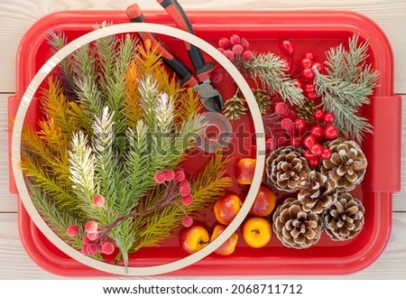 top view of variety items for making a Christmas wreath, step 2, xmas homemade decor