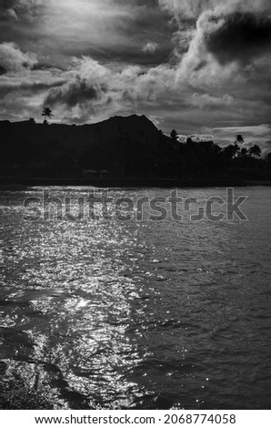 Waikiki Bay with a Silhouette of Diamond Head Crater in the Backdrop.  Room for message as a book cover or advertising template.
