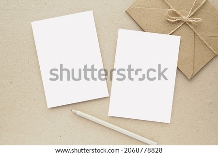 Two notecards, postcards, greeting cards mockup, brown envelope, pampas grass, blank letter paper or note paper for design or text presentation. Royalty-Free Stock Photo #2068778828