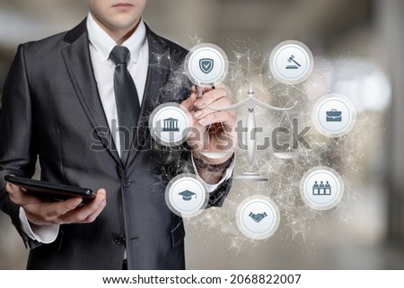 Lawyer works with the structure of justice on a blurred background.