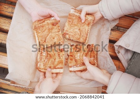 The pie is divided into 4 parts. The food is ready to eat. Puff pastry for baking. Food delivery