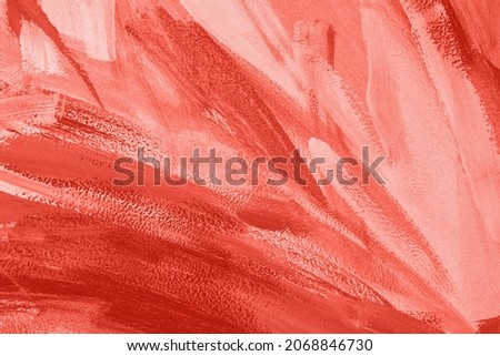 Trendy red abstract art color texture background with traces, brushstrokes and spots of paint. Year color concept