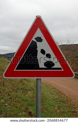 Falling rocks (land slide) warning sign up close, Nonnweiler, Saarland, Germany 
