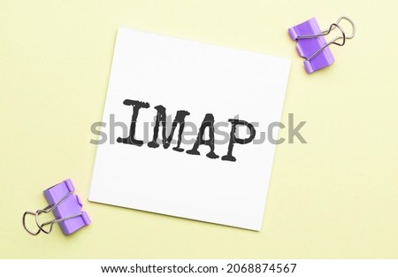 white paper with text seo on a yellow background with stationery