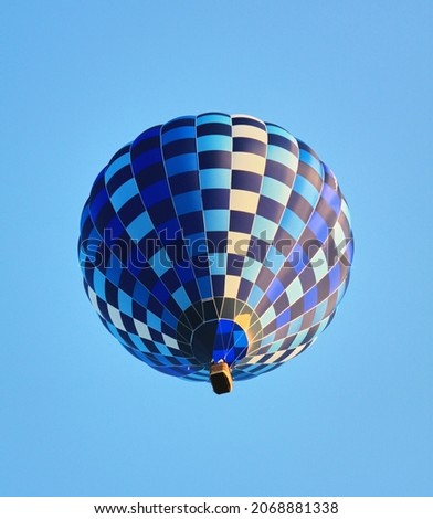 Blue air balloon flying in the clear blue sky. High quality photo Royalty-Free Stock Photo #2068881338