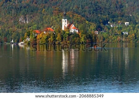 View of Lake Bled with Assumption of Maria Church on island on the background of Julian Alps mountains in Slovenia, Europe                               