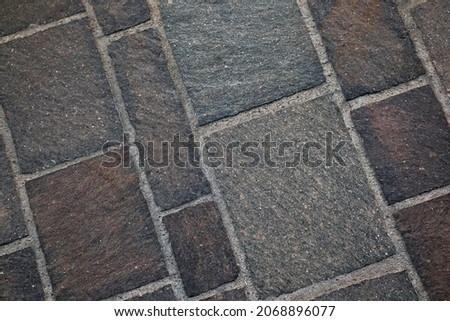 Variable rectangular rock floor tiles close up