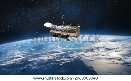 Hubble space telescope on orbit of Earth planet. Space observatory research. Elements of this image furnished by NASA