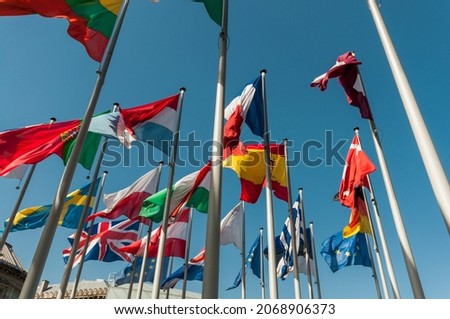 International Flags in front of blue Sky